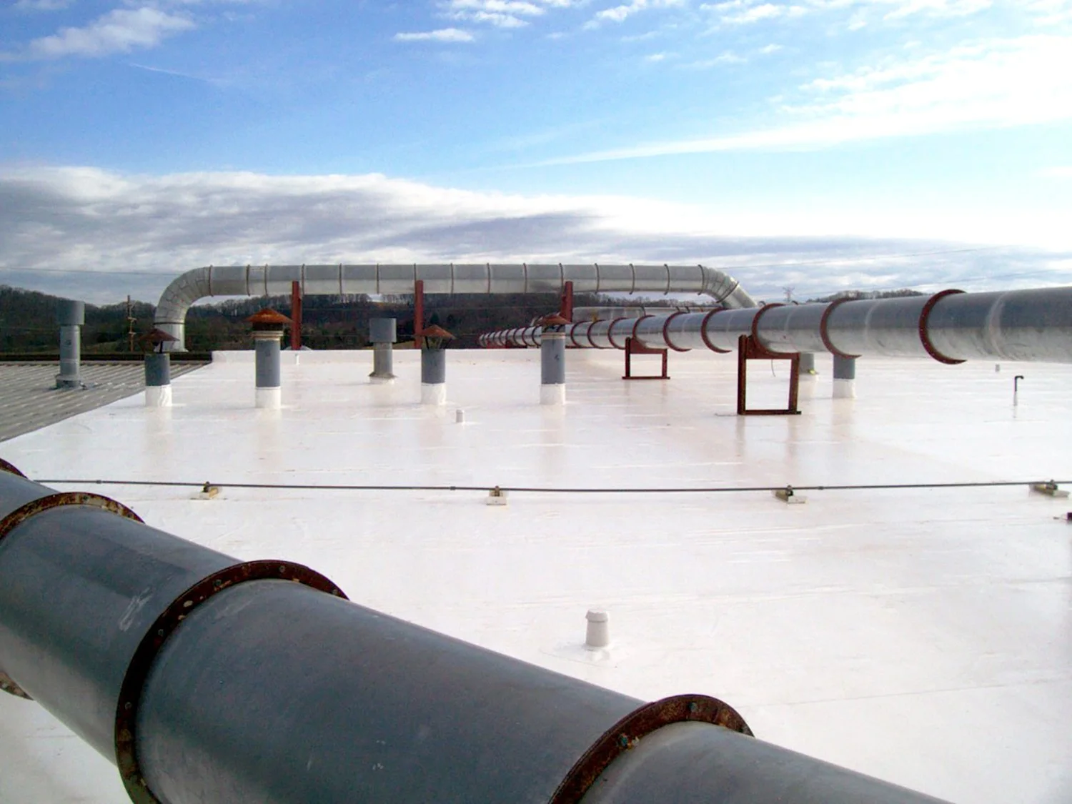 Replacement vs. Recover Analysis commercial roof planning in New Orleans