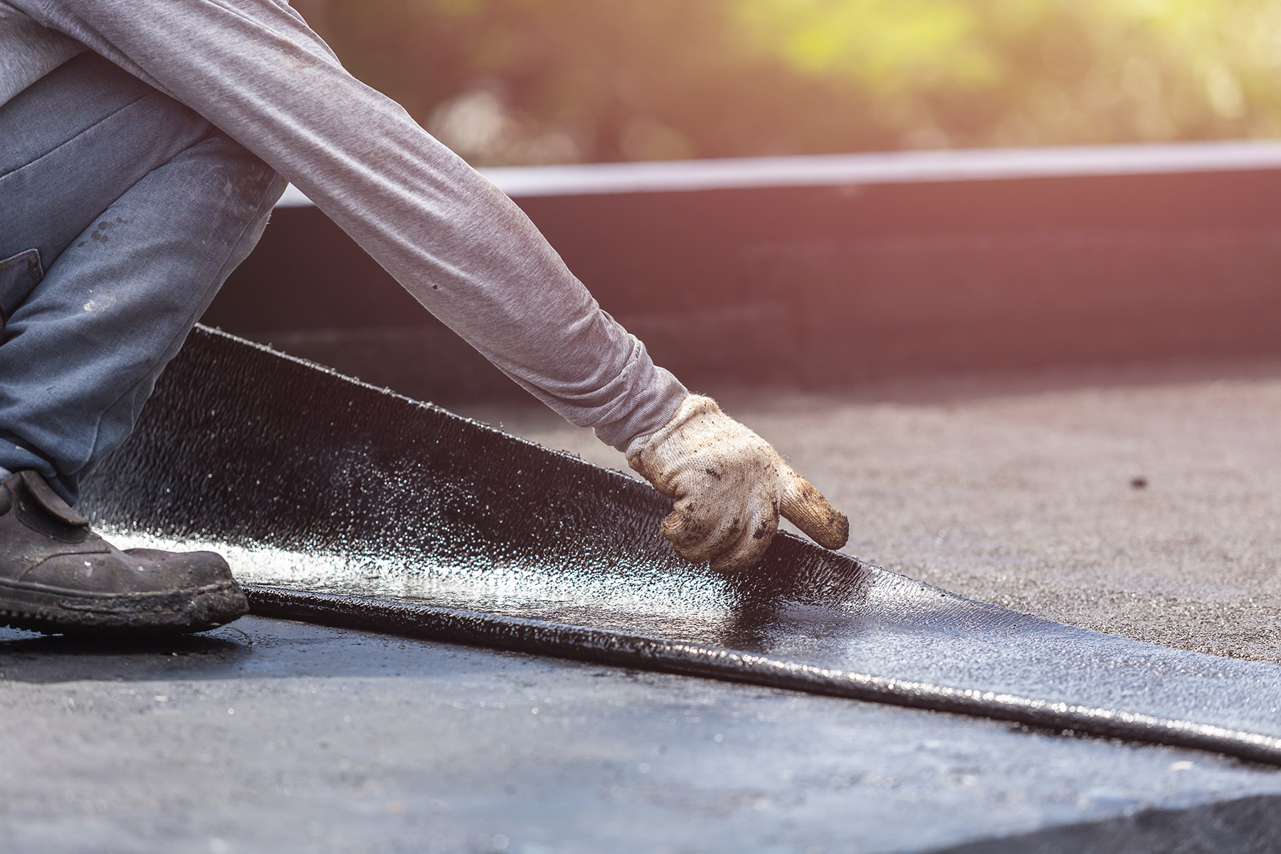 Commercial roof planning crew on a low-slope roof
